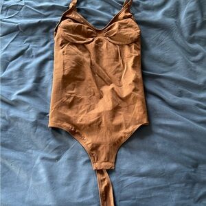 Brown bodysuit contour
